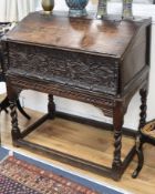 A 17th century carved oak bible box/desk on spiral twist stand (made up) W.88cm