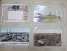 A large album of Edwardian and later postcards including Jamaica, Merchant Ships, Buenos Aires,