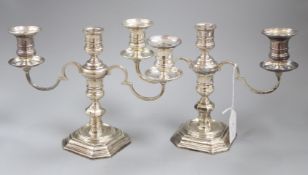 A pair of 1960's silver three light two branch dwarf candelabra by Elkington & Co, Birmingham, 1968,