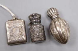 A late Victorian miniature scent flask, one other silver scent flask and a George V silver stamp