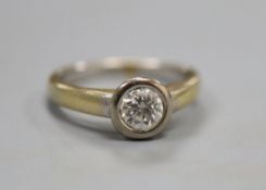 A diamond and 18ct gold solitaire ring, size M/N.