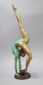 A painted bronze of a gymnast height 54cm