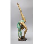 A painted bronze of a gymnast height 54cm