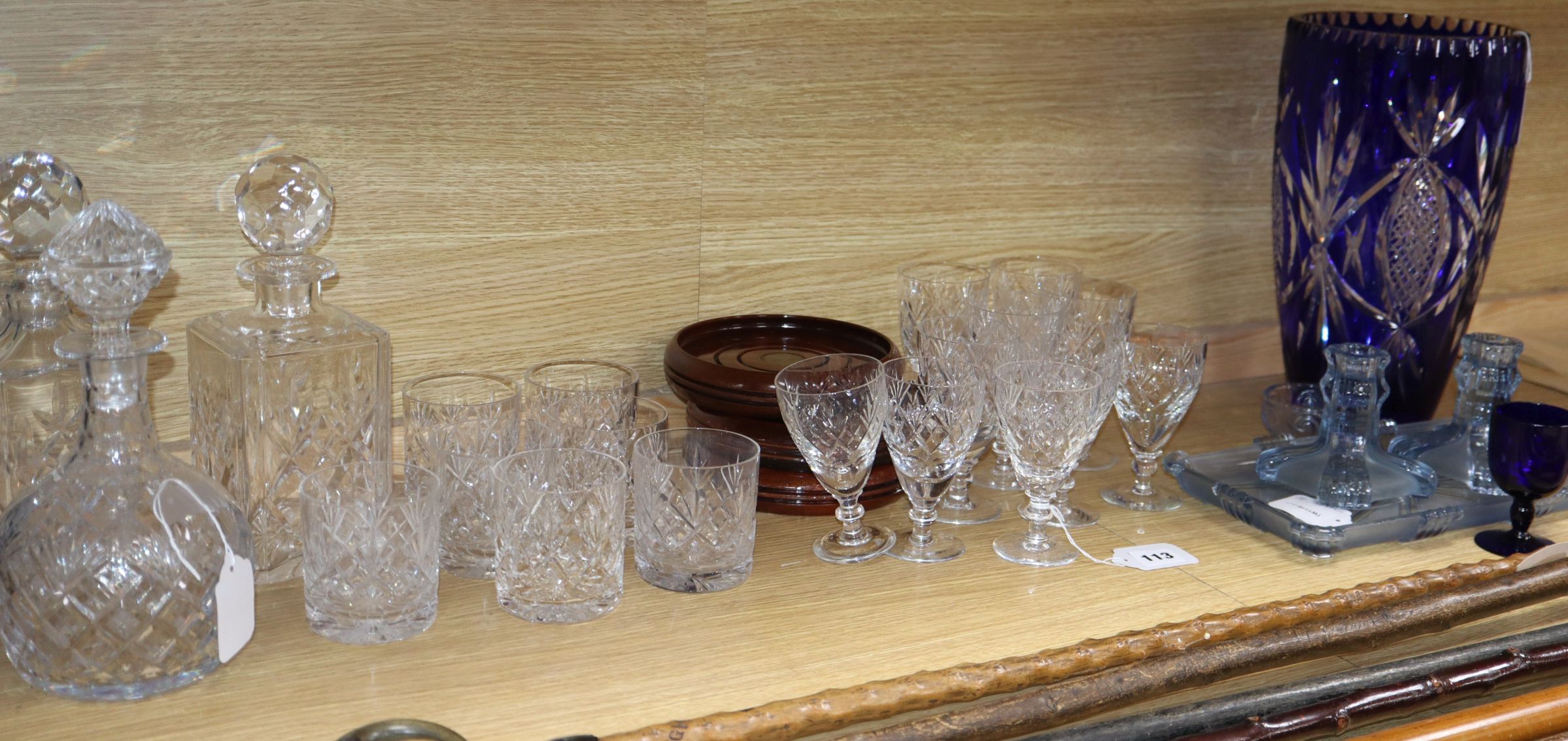 A part suite of Webb & Corbett table glassware, three decanters, a matched dressing table set and