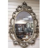 A Victorian style silvered frame oval wall mirror H.138cm