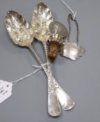 A pair of Scottish George III silver berry spoons, Edinburgh 1799 (later embossed) and two other