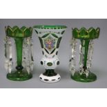 A pair of Victorian green glass table lustres and a 1950's Bohemian green and white layered glass