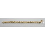 An Italian 750 yellow metal hollow circular link bracelet, 17.5g, 21.5cm.