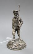 A silver plated model of a soldier height 12cm