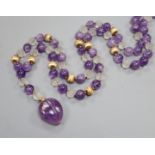 Kai-Yin Lo, Hong Kong, an amethyst, reeded glass and 14k bead necklace with carved fruit pendant, (