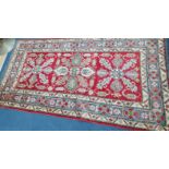 An Afghan rug 230 x 118cm