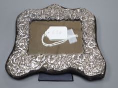 A modern repousse silver photograph frame, with floral decoration, Keyford Frames Ltd, London, 1991,