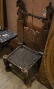 An African carved hardwood tribal chair