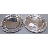A pair of early Victorian silver plates, with gadrooned border and engraved armorial, by