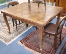 An early 20th century French oak draw leaf dining table W.130cm