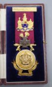 A cased 1960's 9ct gold, enamel and base metal masonic badge to H.R. Wright L.G.C.R., with