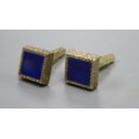 A pair of 1970's textured 9ct gold and lapis lazuli set cufflinks, gross weight 13 grams.