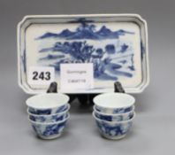 Six 19th century Chinese blue and white 'horses' tea bowls and a later blue and white tray length