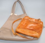 A Gucci tan leather bag and a Celine leather bag