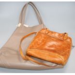 A Gucci tan leather bag and a Celine leather bag