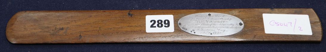 A letter opener purported to be from HMS Victory with silver plaque