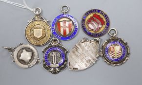 Six assorted early 20th century and later silver fob medals including enamel and football related