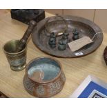 A group of mixed Eastern metalwares including pestle and mortar, weights, copper basin, etc. largest