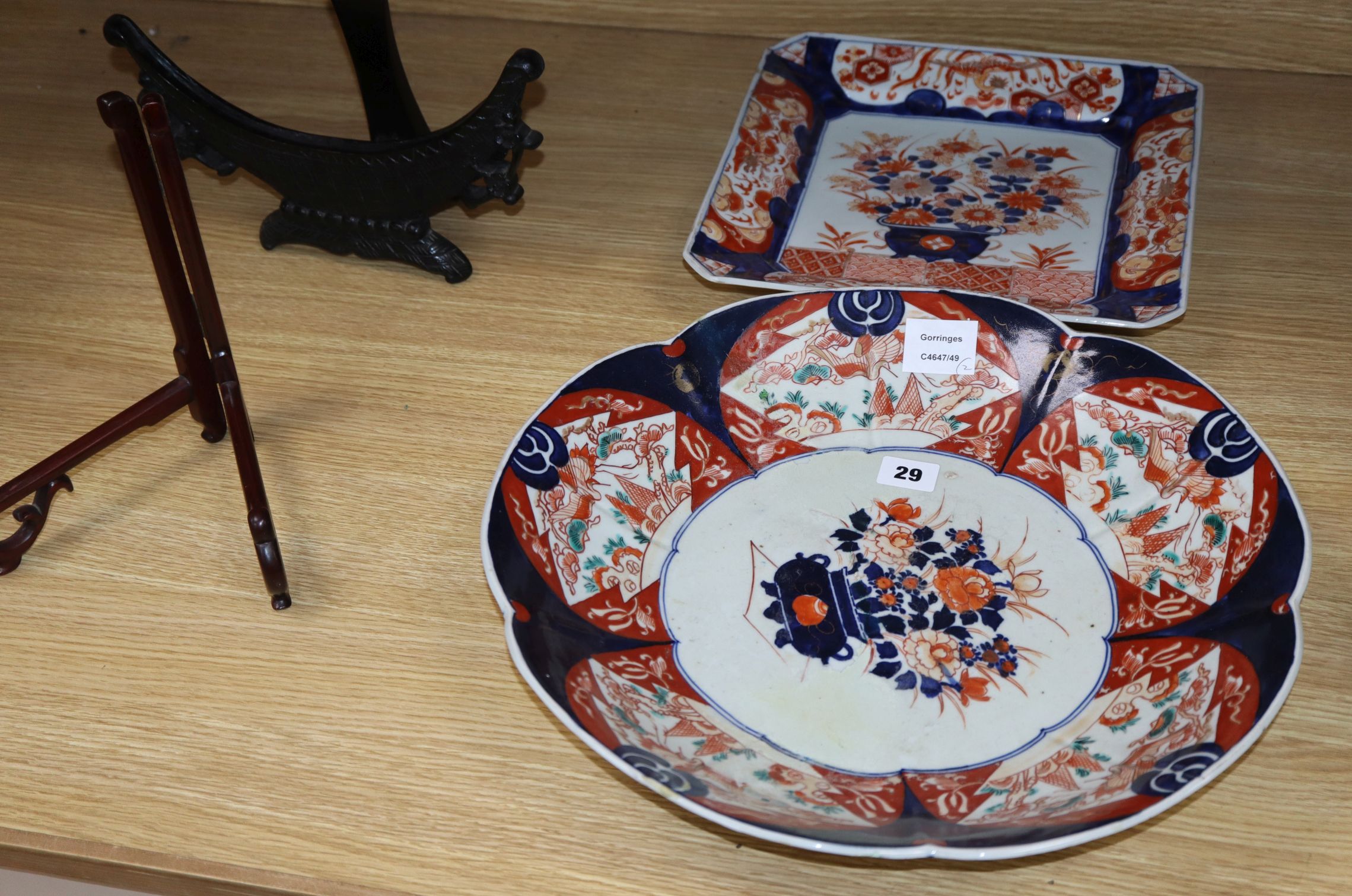 Two large Japanese Imari dishes and two stands largest diameter 40cm