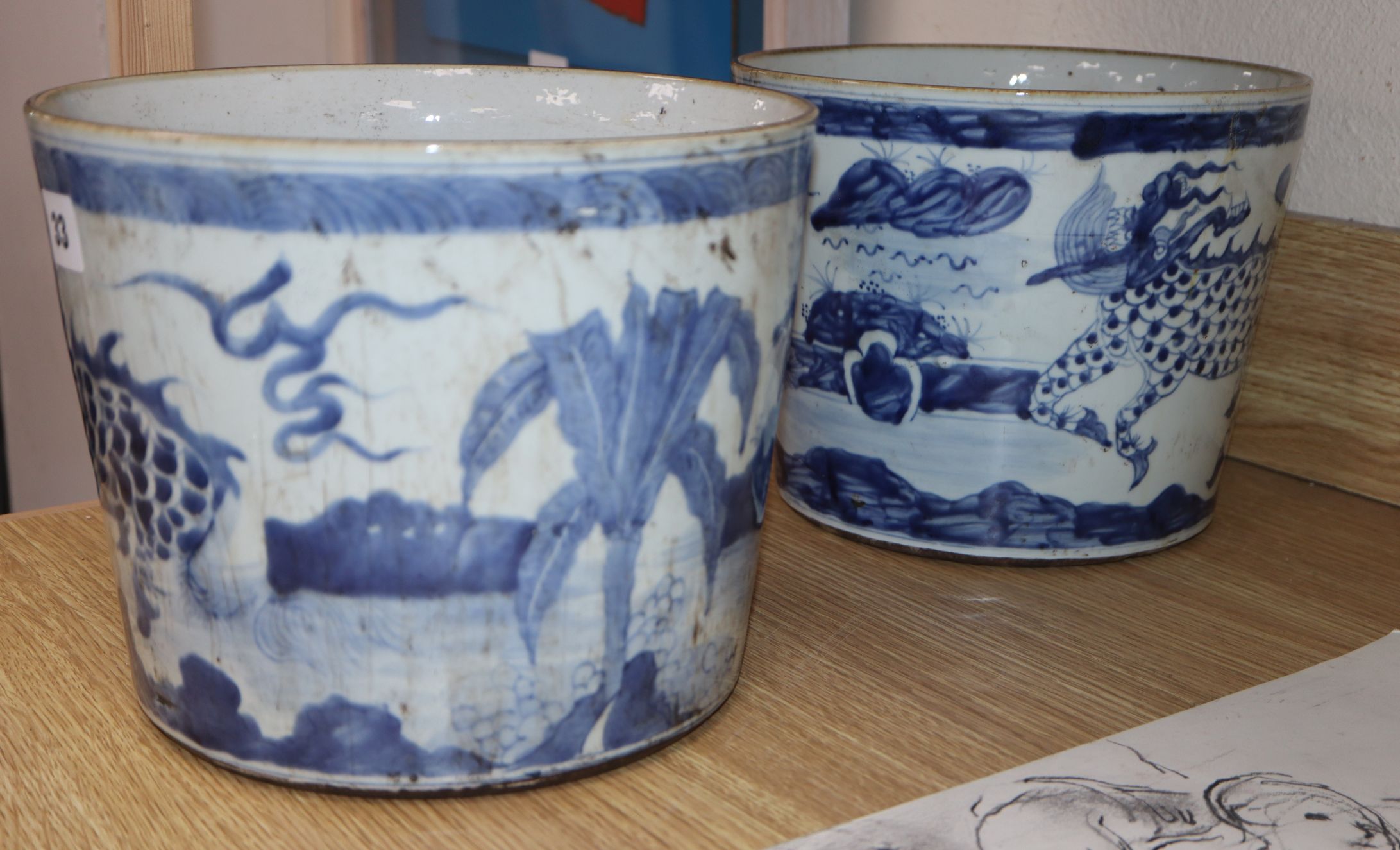 A pair of Chinese blue and white 'qilin' ice pails height 20cm