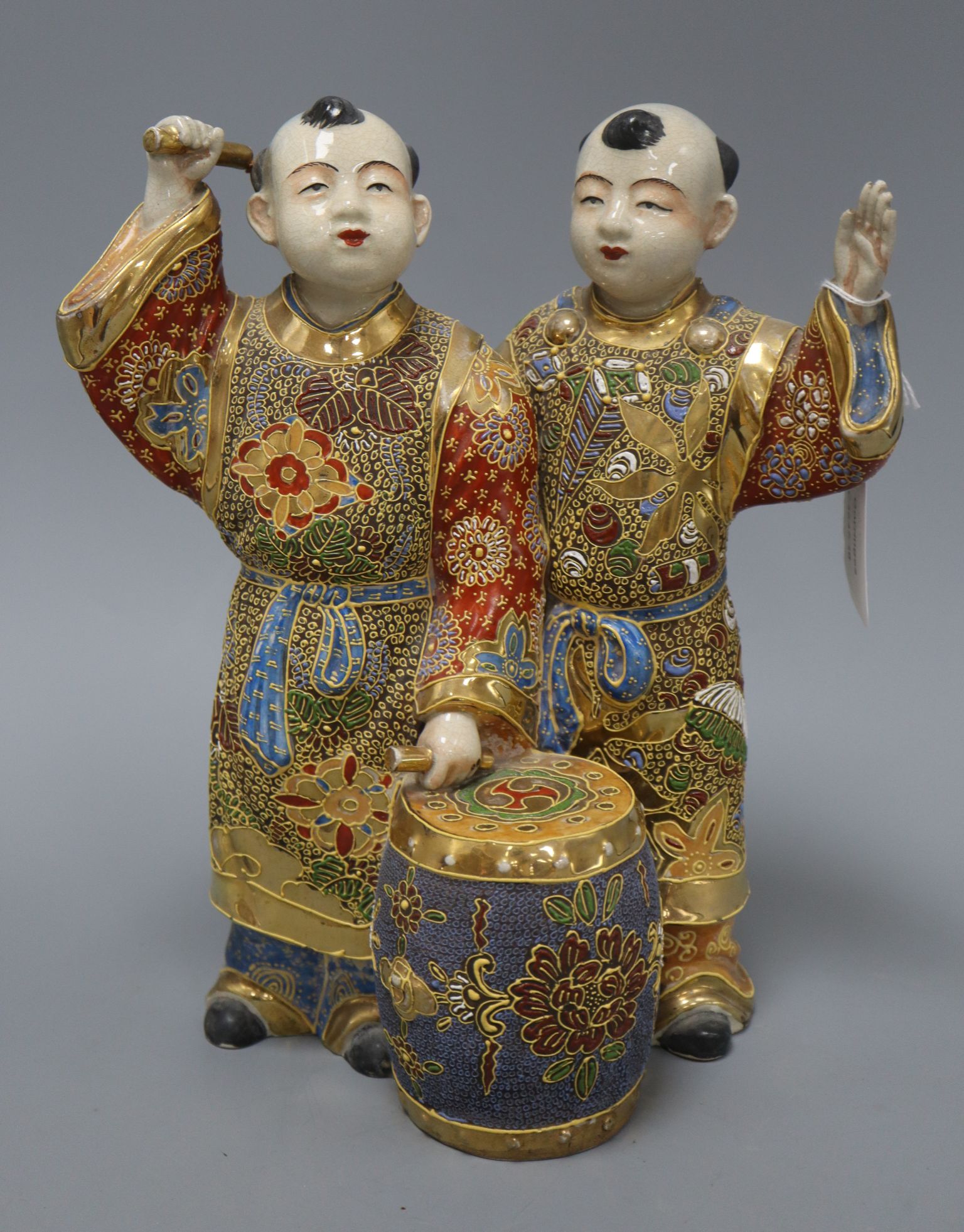 A Satsuma pottery group of two boys drumming height 28cm