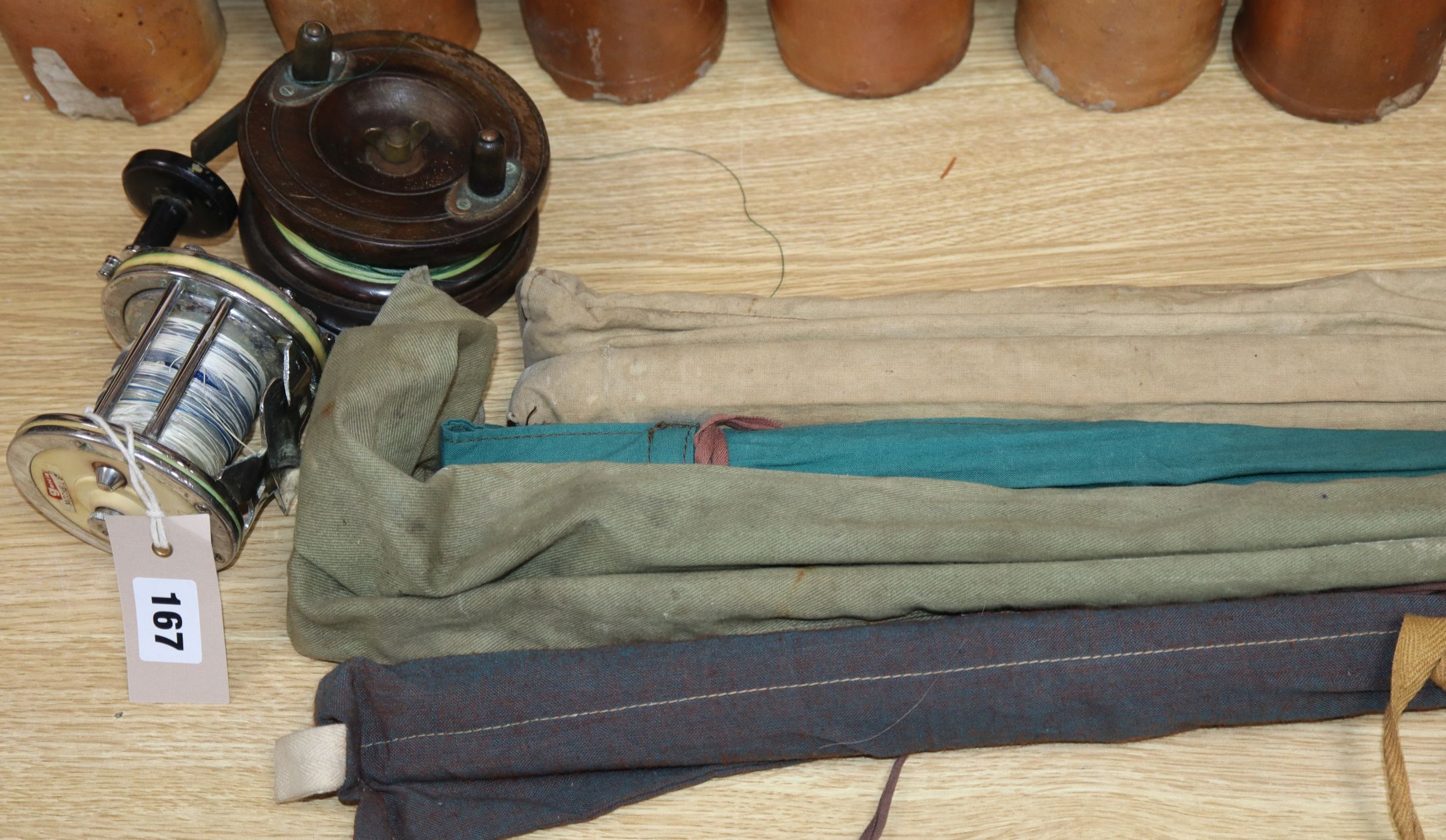 Two sea reels, a Constable of Bromley fly rod, a B James & Sons fly rod and two other rods (some