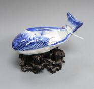 A Chinese blue and white 'fish' dish, carved hongmu stand length 13cm