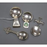 Four assorted Arts & Crafts style silver caddy spoons including enamelled, two Scottish including