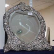 A late Victorian silver-mounted easel toilet mirror with heart-shaped plate, all over pierced with