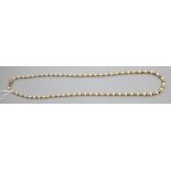 A cultured pearl and yellow metal bead necklace, approx. 70cm.