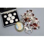 A silver charm bracelet and other jewellery including costume.