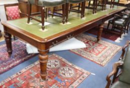 A Victorian style leather topped mahogany boardroom table, fitted four drawers on six fluted tapered