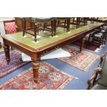 A Victorian style leather topped mahogany boardroom table, fitted four drawers on six fluted tapered