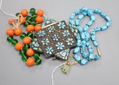 A Tibetan turquoise-set prayer box (now on glass bead suspension) and a turquoise necklace hung with