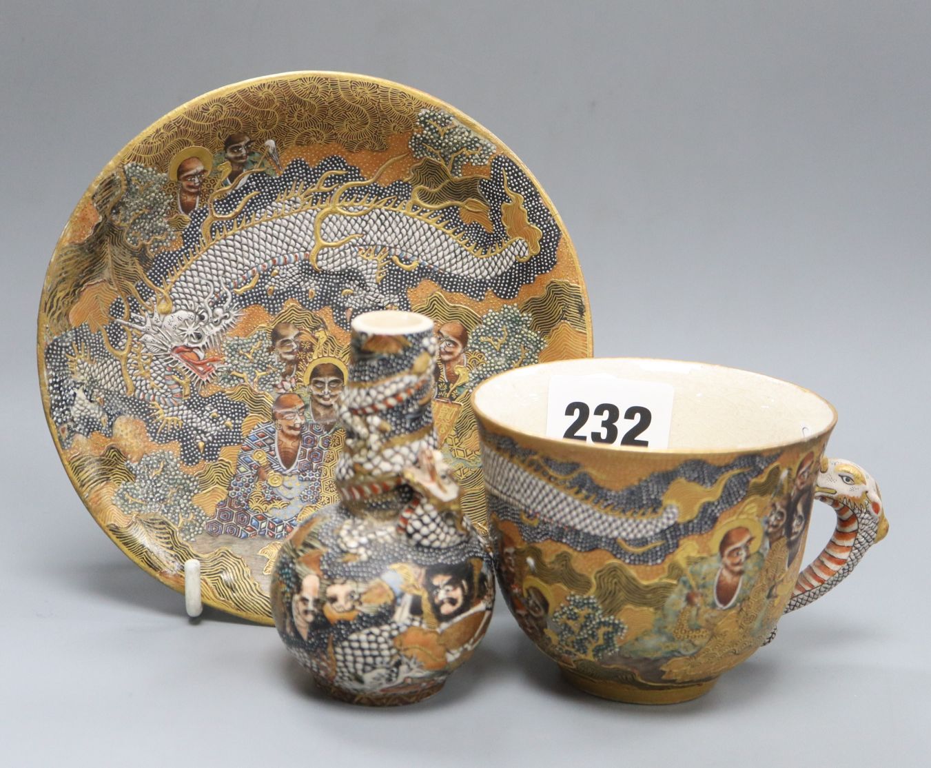 A Japanese Satsuma bottle vase and a cup and saucer