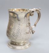 A George II silver baluster mug, with later engraved decoration, Thomas Gilpin, London, 1748,