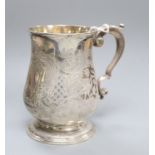 A George II silver baluster mug, with later engraved decoration, Thomas Gilpin, London, 1748,