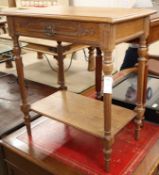 A carved oak two tier side table W.70cm