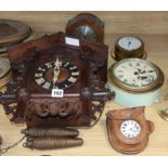 A cuckoo clock and four others
