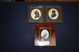 A pair of framed silhouettes and oval portrait miniature