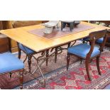 An extending conservatory table, with slatted cherrywood top over a Spanish style wrought iron