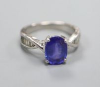 A tanzanite and diamond ring (the tanzanite approx 3.32ct), platinum setting and shank, size O.