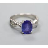 A tanzanite and diamond ring (the tanzanite approx 3.32ct), platinum setting and shank, size O.