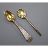 Two 19th century Russian 84 zolotnik gilt white metal and niello spoons, largest 13.7cm.