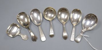 Seven assorted 19th century and later silver caddy spoons including Robert Hennell II?, London,